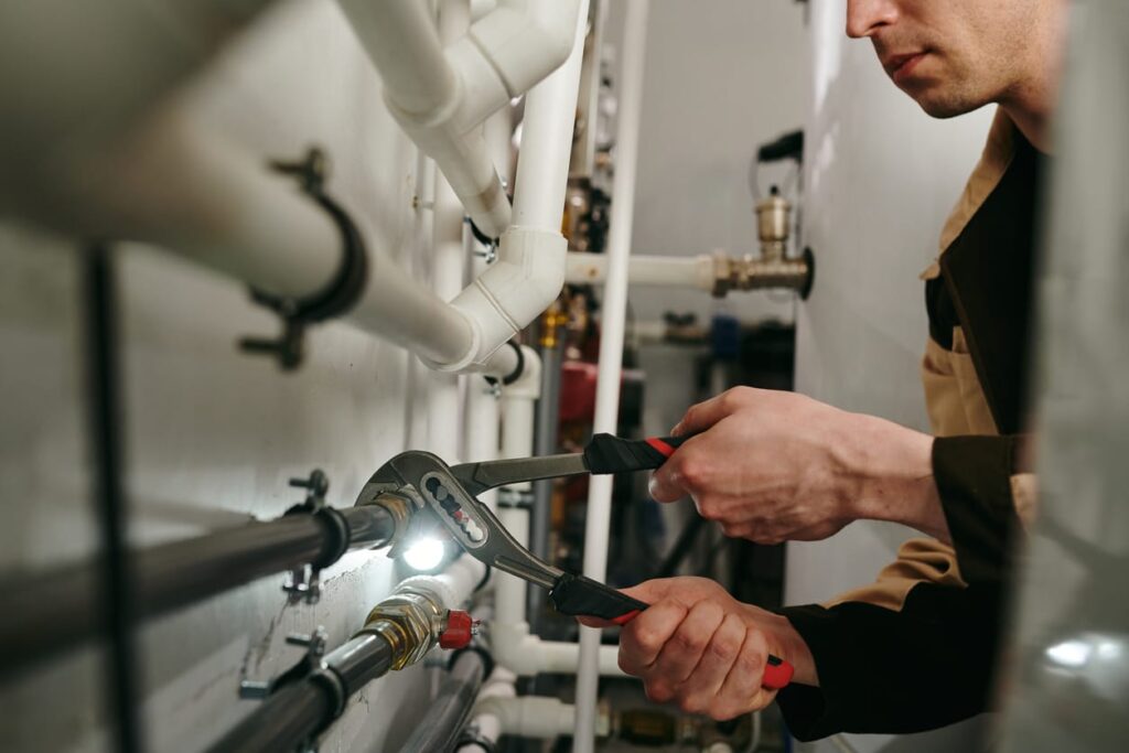 Plumbers maintaining commercial plumbing pipes in Gainesville